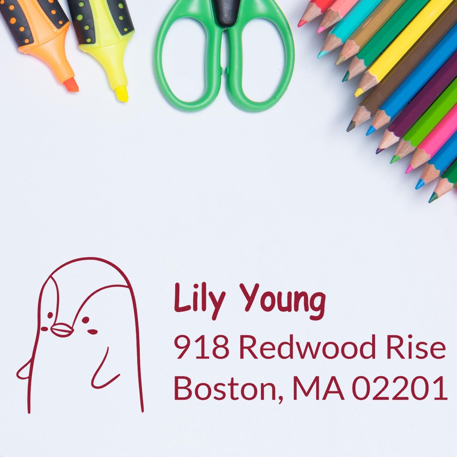Personalized rubber address stamp with name and Boston, MA return address, framed by colorful school supplies.