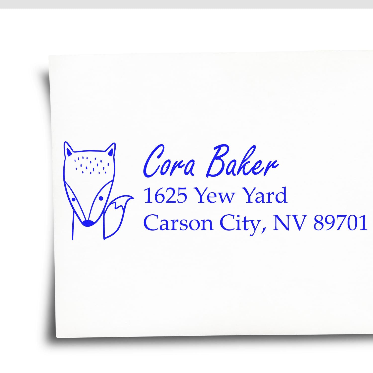 Custom rubber address stamp with fox logo for Cora Baker, 1625 Yew Yard, Carson City, NV 89701.