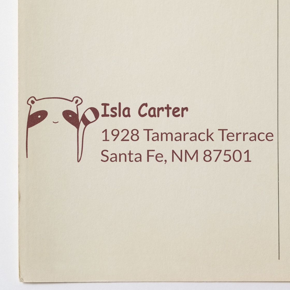 Personalized rubber address stamp for Isla Carter, with bear illustration and Santa Fe, NM return address.