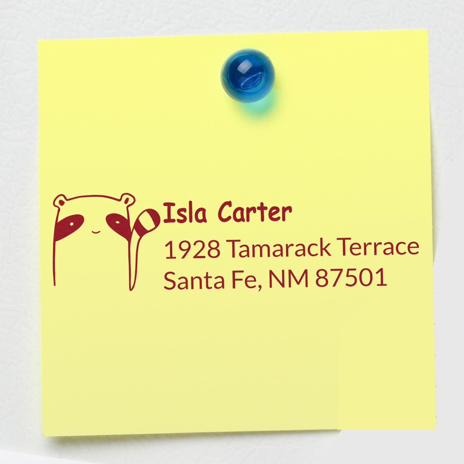 Custom address rubber stamp with raccoon logo for Isla Carter, Santa Fe, NM 87501.