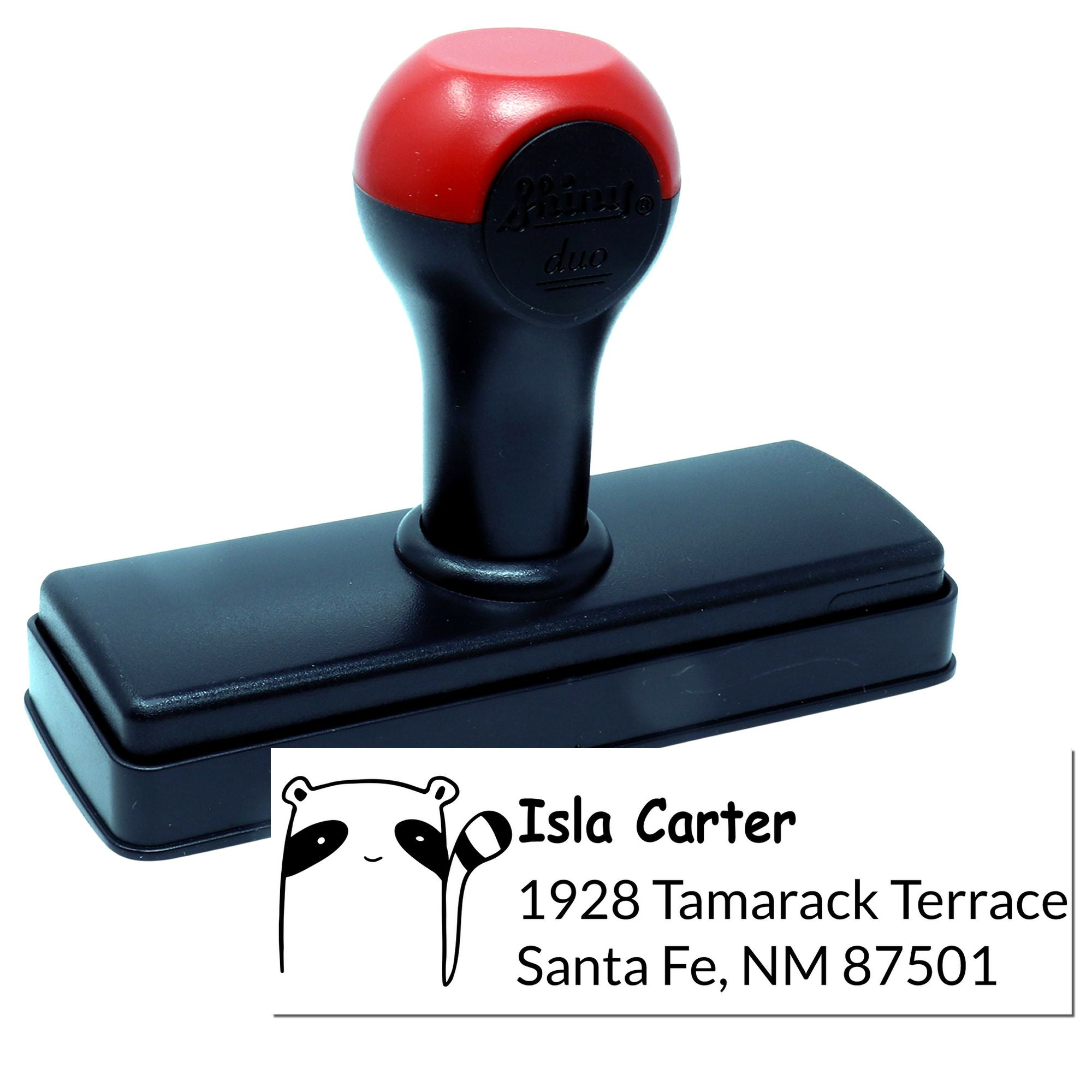 Custom self-inking rubber address stamp with panda logo and Santa Fe, NM return address, personalized for Isla Carter