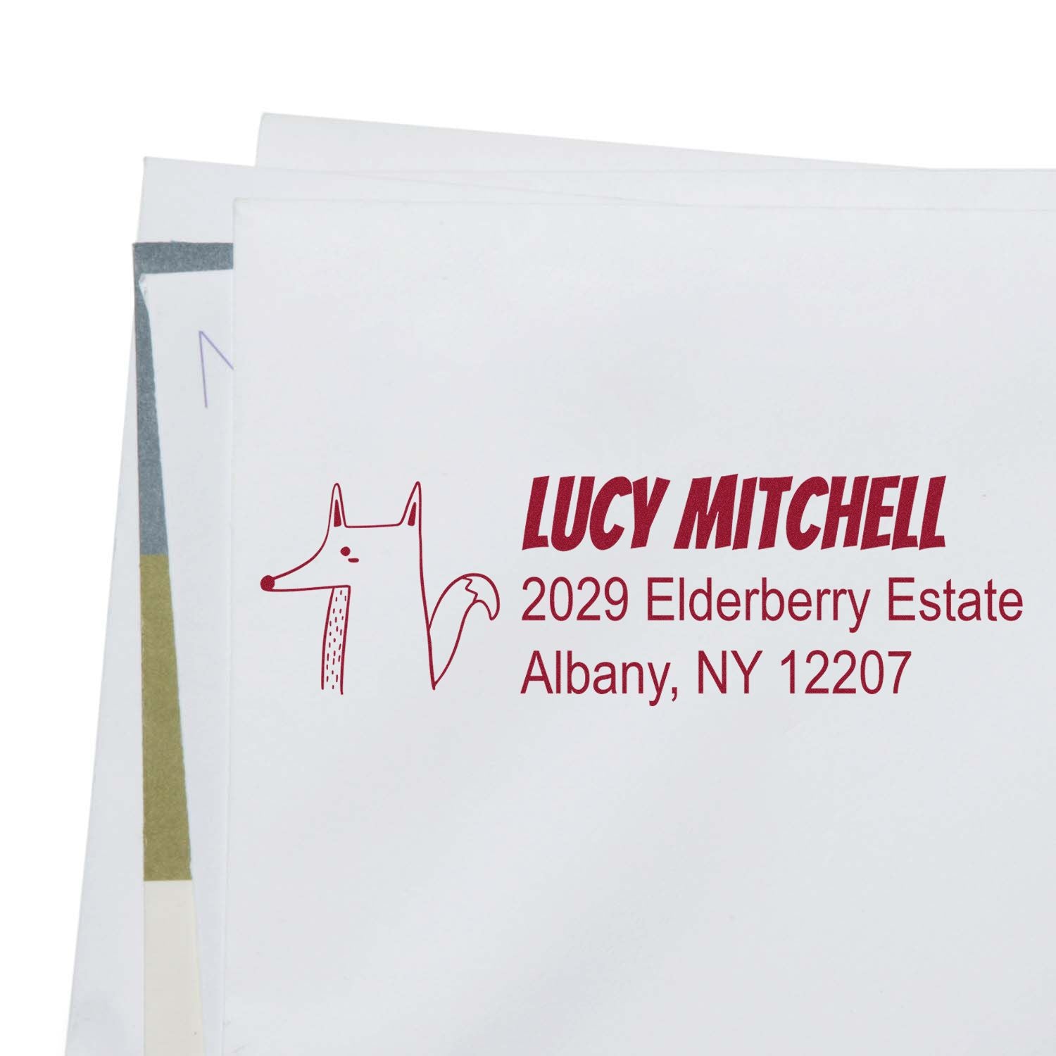 Personalized rubber stamp return address on envelope with fox design, Lucy Mitchell, Albany, NY 12207