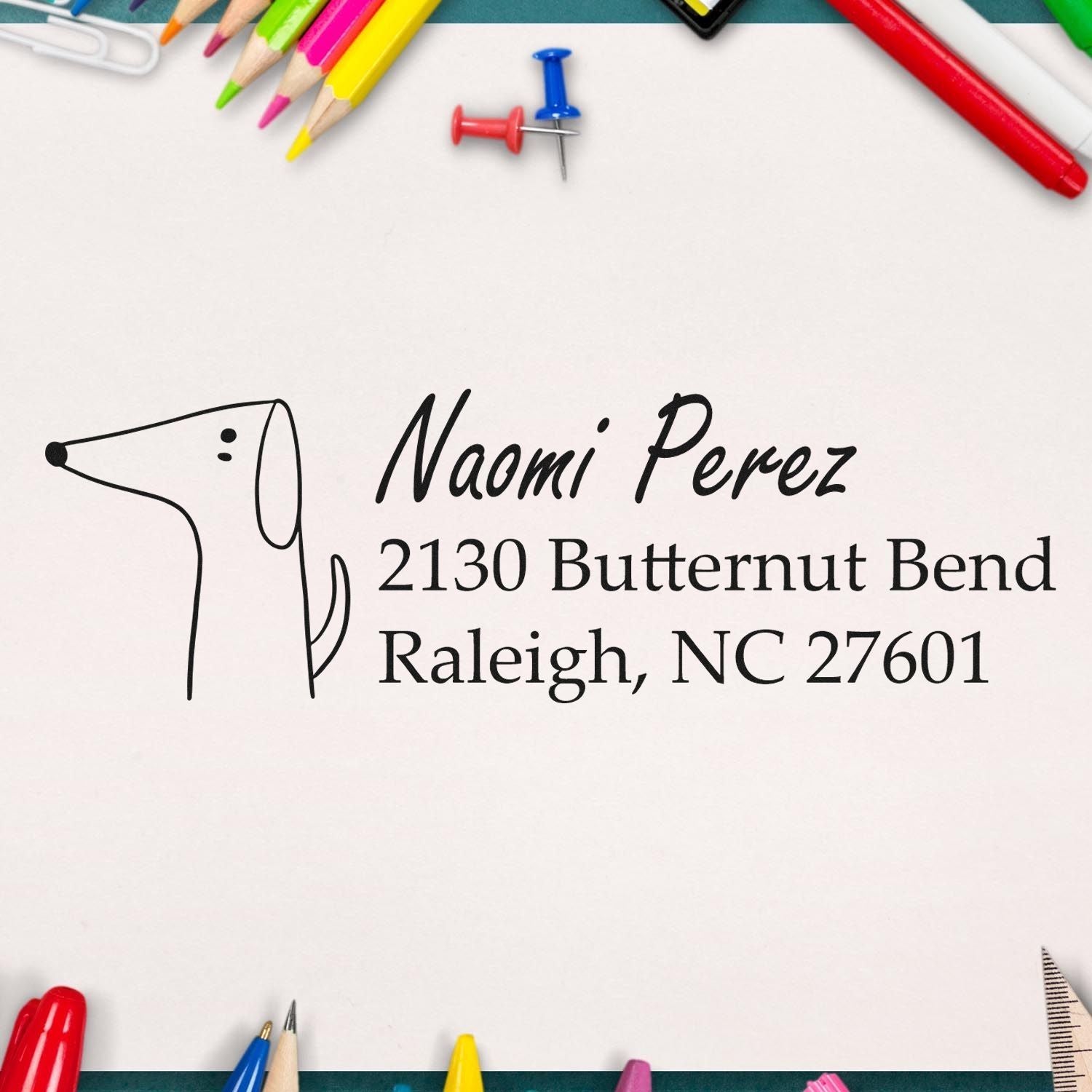 Custom rubber return address stamp with dog design for Naomi Perez, ideal for personalized mailing envelopes and stationery.