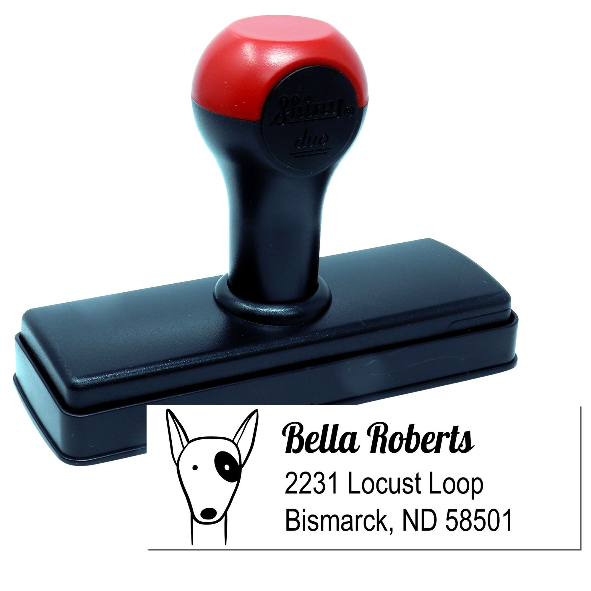 Custom self-inking rubber address stamp with dog logo, Bella Roberts name, and Bismarck, ND mailing address.