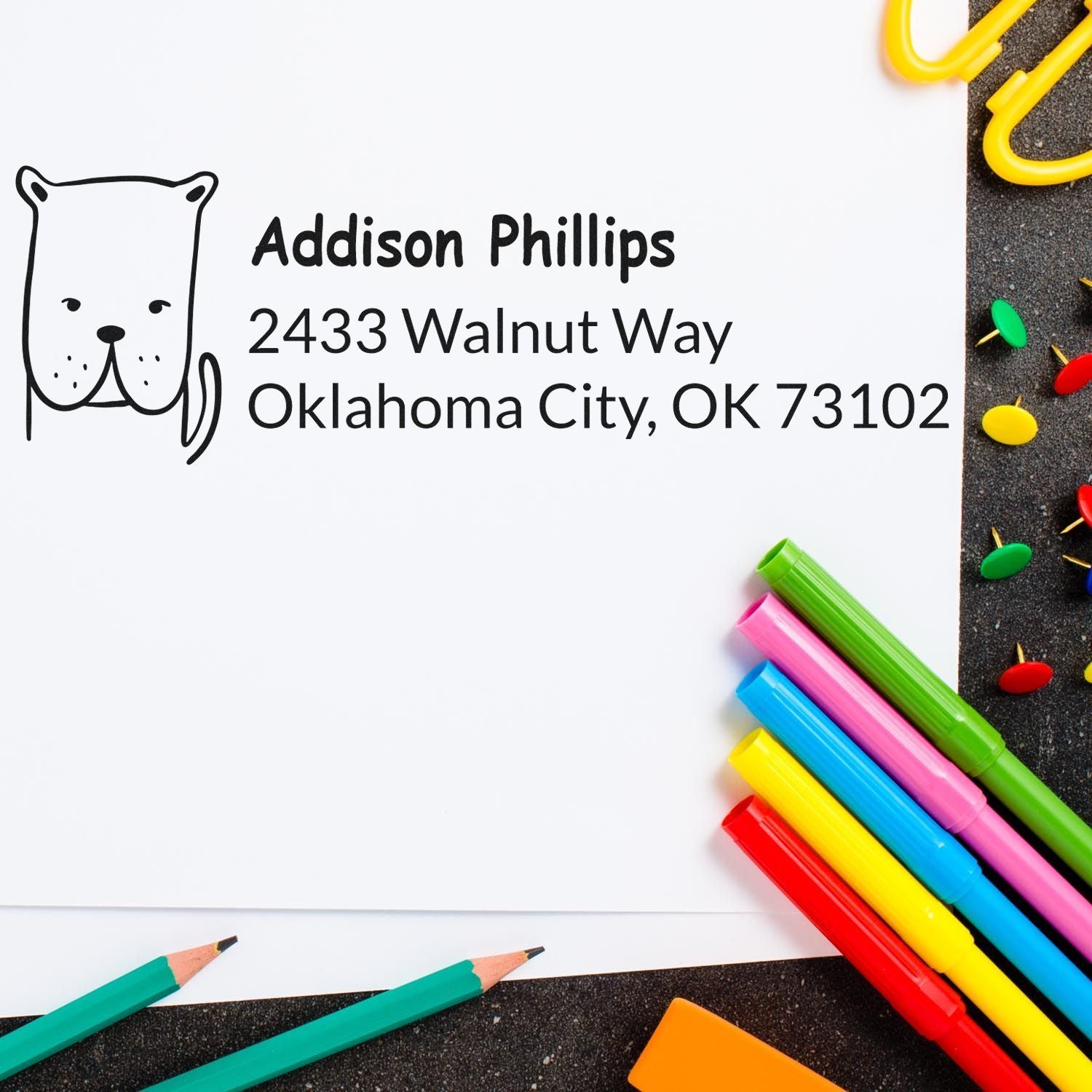 Custom rubber stamp with dog icon and return address for Addison Phillips, Oklahoma City, OK 73102.