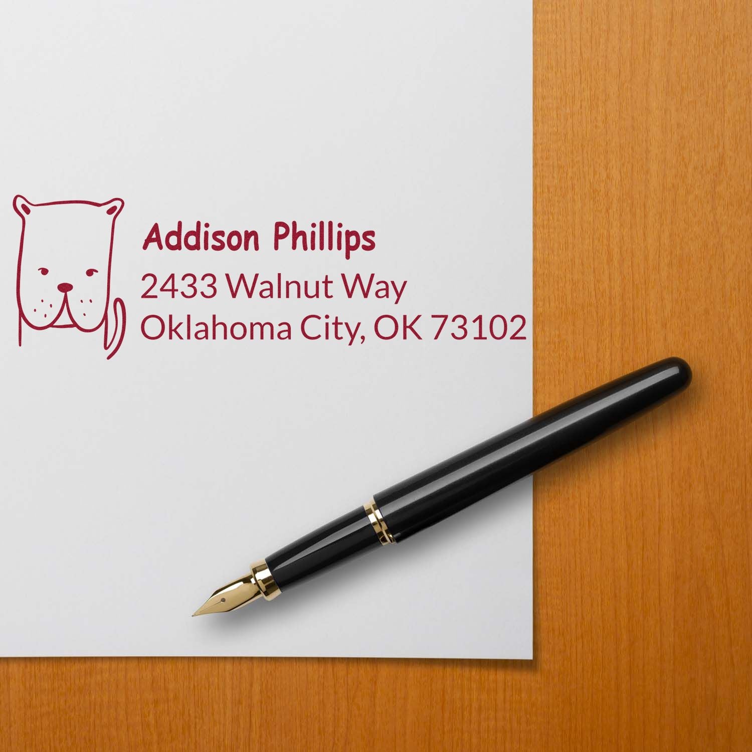 Custom return address rubber stamp with cat icon for Addison Phillips, 2433 Walnut Way, Oklahoma City, on stationery.