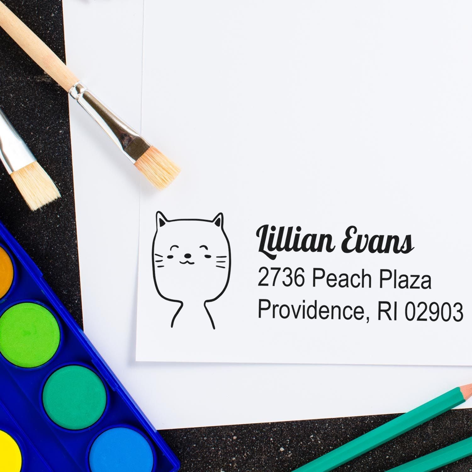 Custom rubber address stamp with cat logo and business name, ideal for personalized envelopes, branding, and packaging.