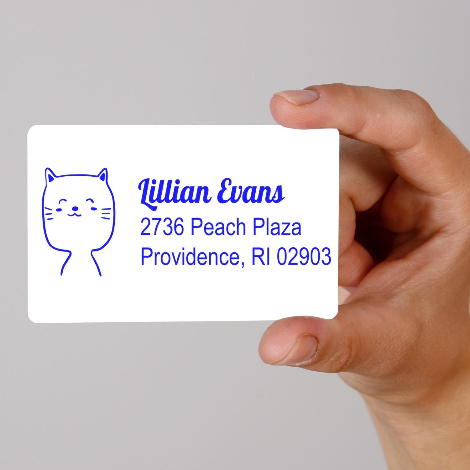 Custom rubber stamp with cat logo and return address for Lillian Evans, Providence, RI 02903