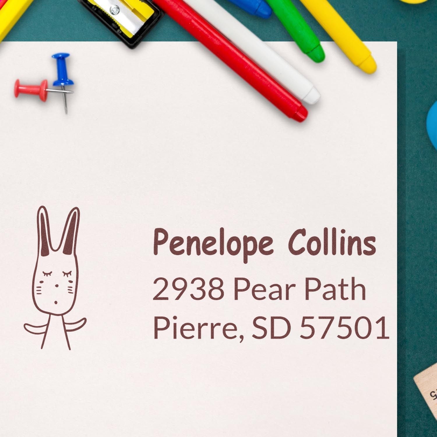 Personalized return address rubber stamp with bunny design for Penelope Collins, Pierre, SD 57501