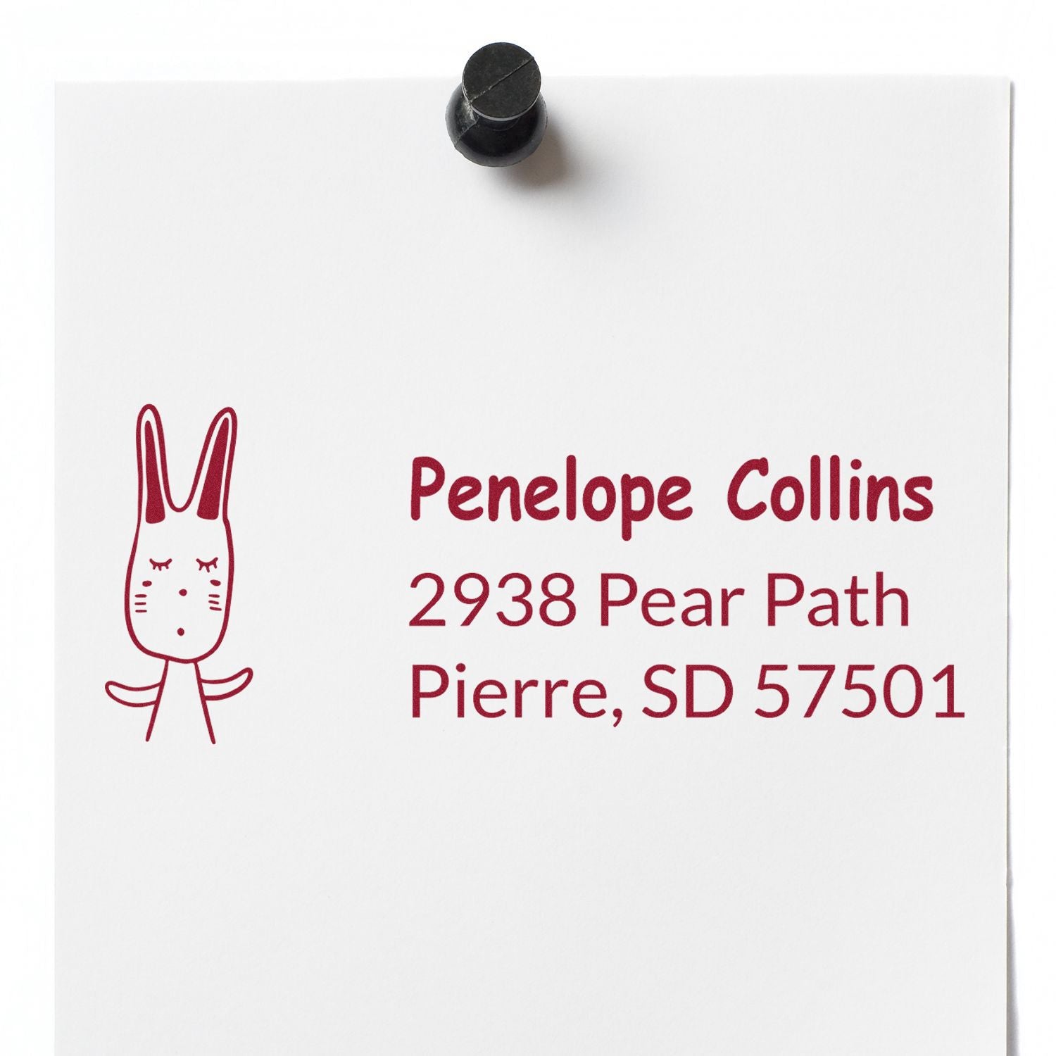 Custom return address rubber stamp with bunny icon for Penelope Collins, 2938 Pear Path, Pierre, SD 57501.