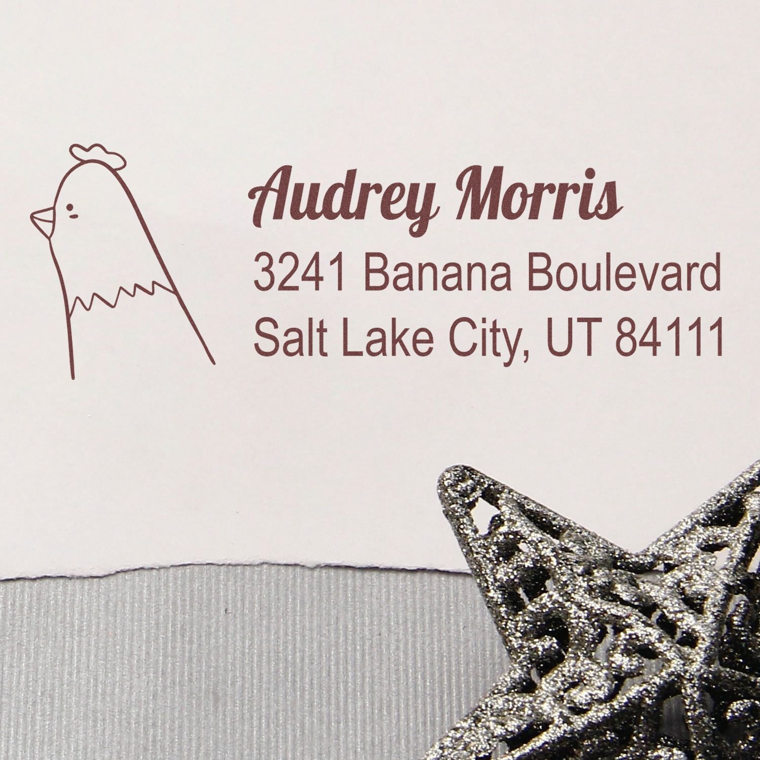 Custom rubber return address stamp with chicken icon for Audrey Morris, Salt Lake City, UT 84111.