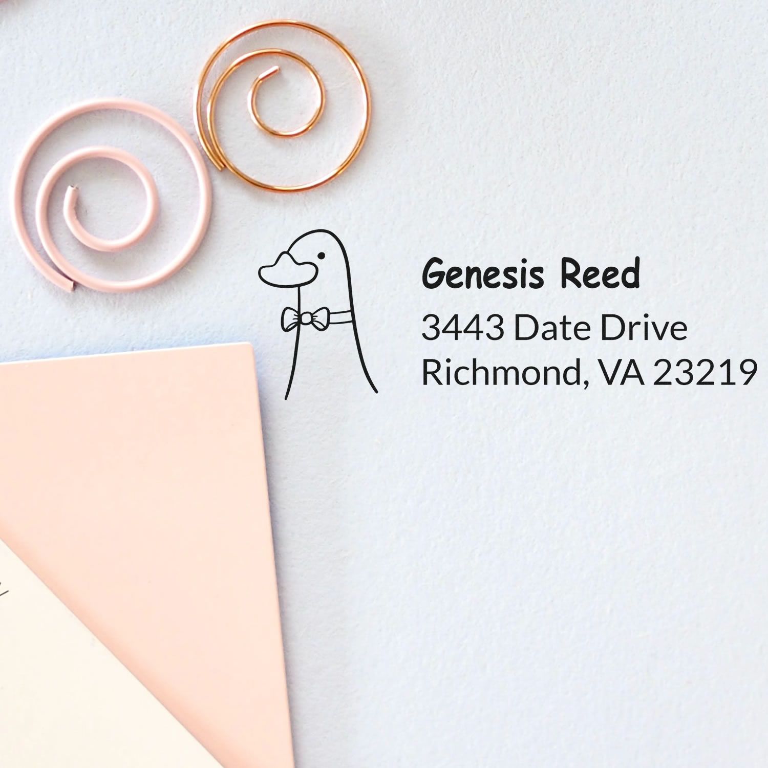 Custom return address rubber stamp for Genesis Reed, Richmond, VA 23219, with duck logo on stationery.