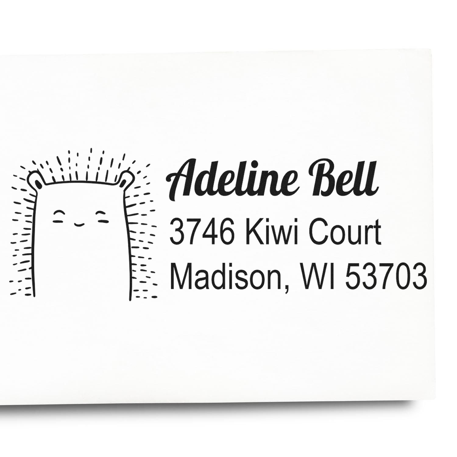 Custom rubber address stamp with cute bear design for Adeline Bell, 3746 Kiwi Court, Madison, WI 53703.