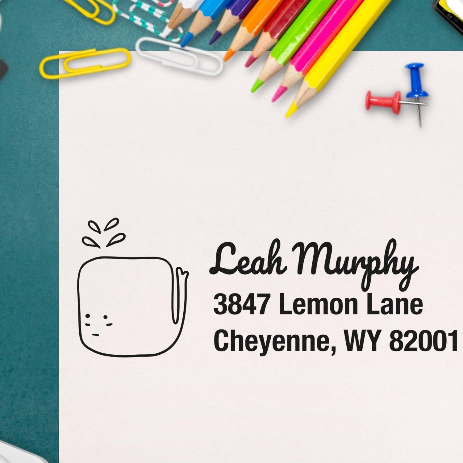 Personalized custom rubber return address stamp with Leah Murphy, 3847 Lemon Lane, Cheyenne, WY 82001 on stationery.