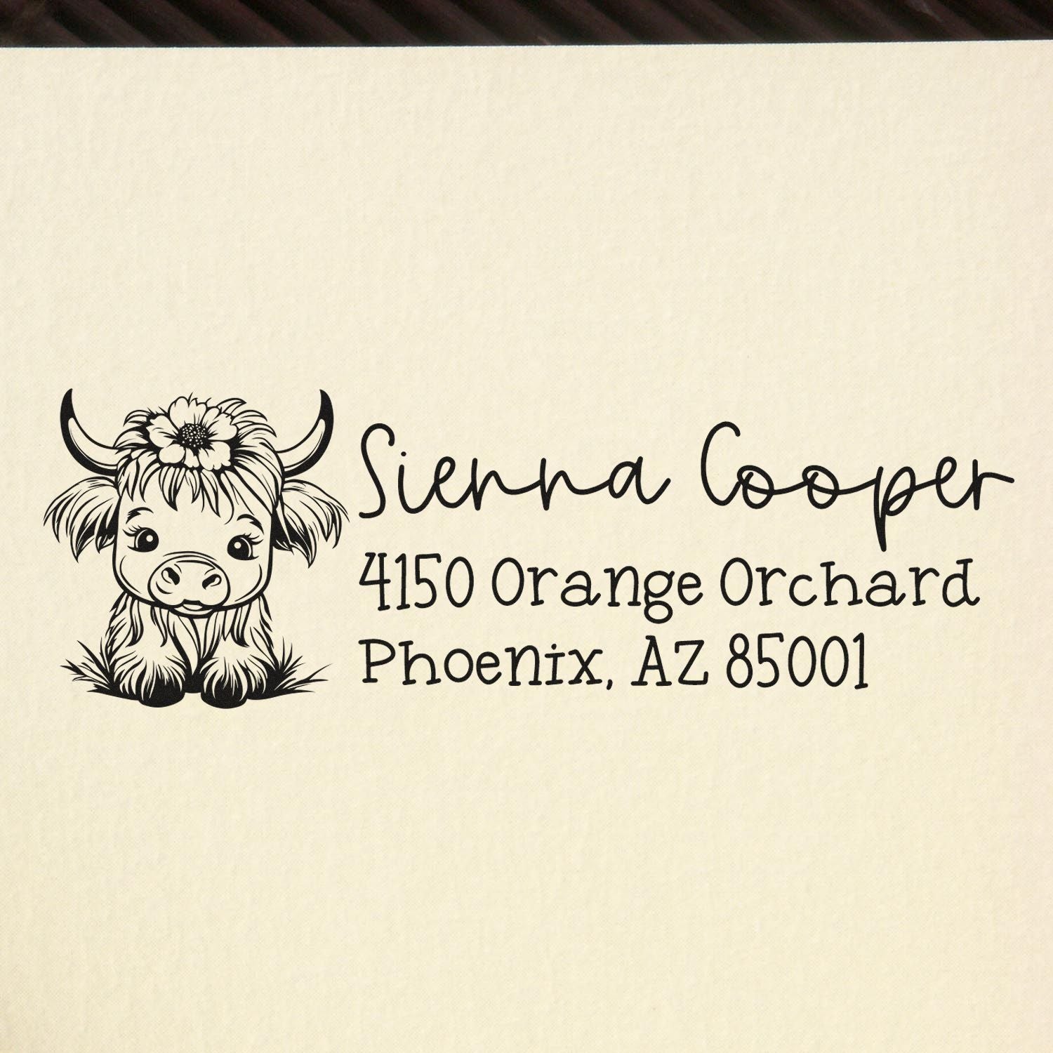 Custom return address rubber stamp with cow illustration for Sienna Cooper, Phoenix, AZ 85001