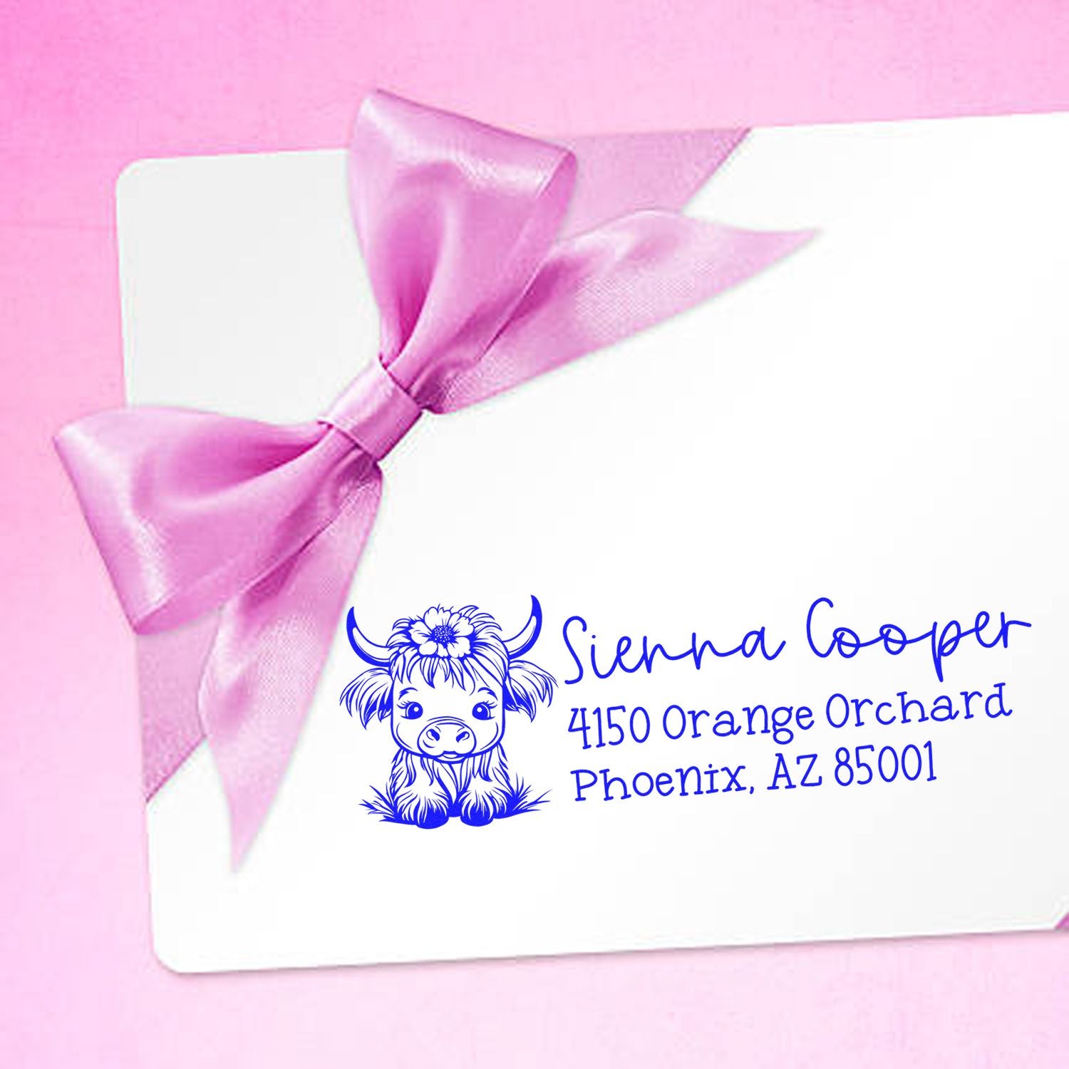 Custom return address rubber stamp with cow logo on pink gift card, ideal for personalized stationery and business branding
