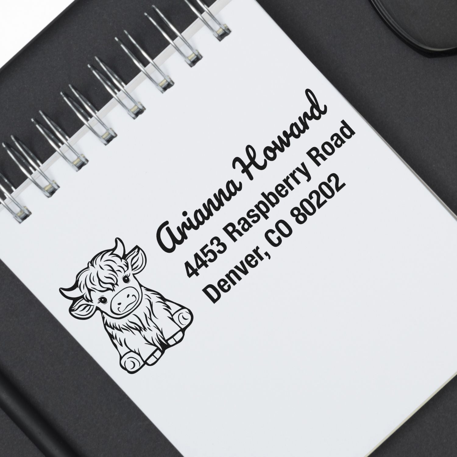 Custom rubber stamp return address with cow design for Arianna Howard, Denver, CO