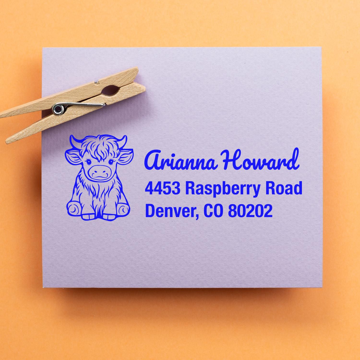 Custom address rubber stamp with cow design for Arianna Howard, Denver, CO 80202.