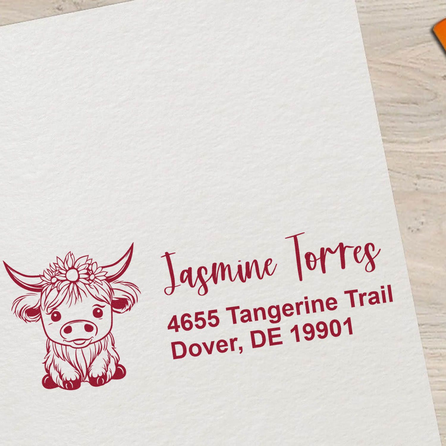 Custom rubber stamp with cow illustration and return address for Jasmine Torres, 4655 Tangerine Trail, Dover, DE 19901