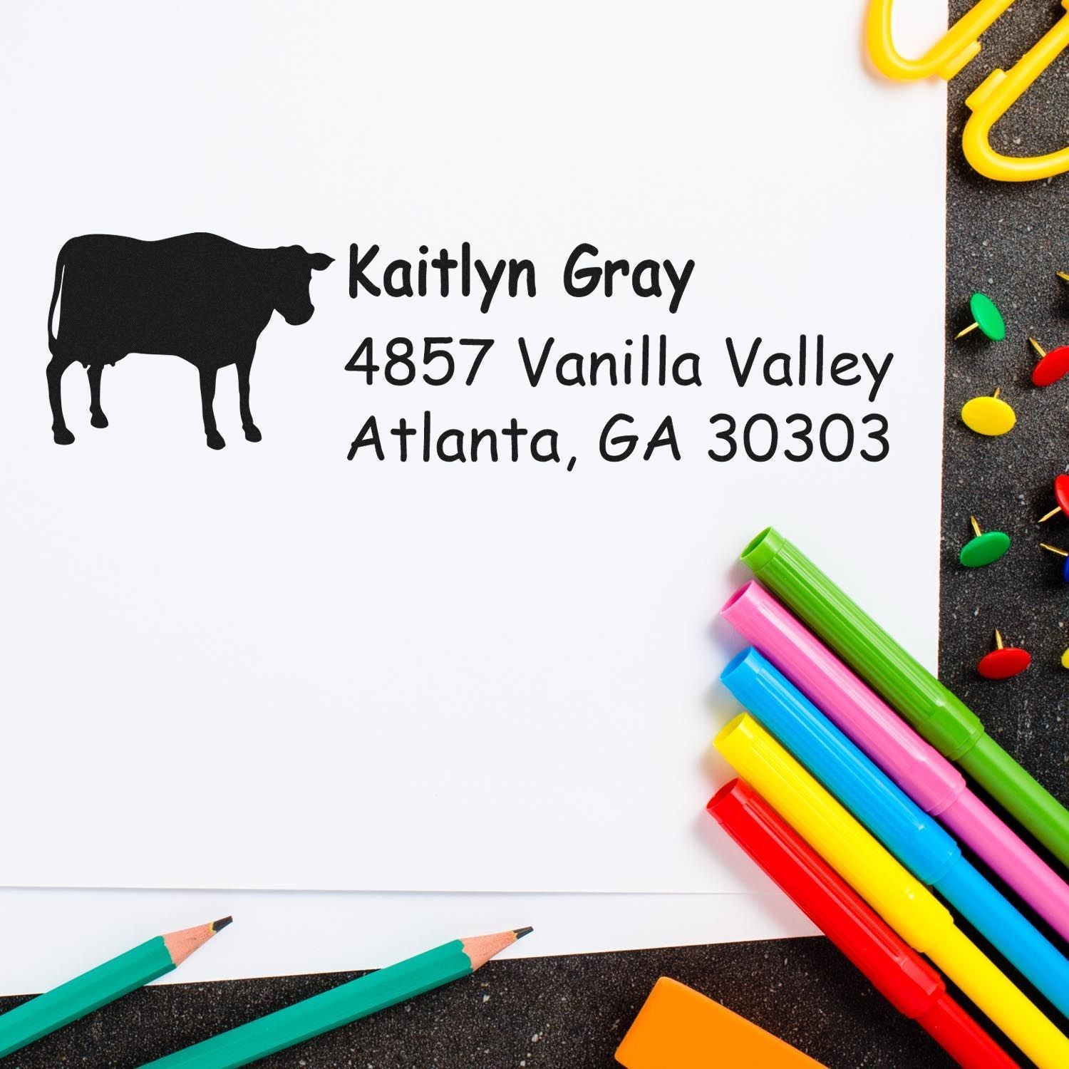 Custom return address rubber stamp with cow logo for Kaitlyn Gray, Atlanta, GA 30303.