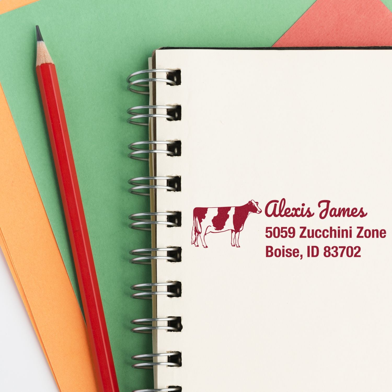 Personalized rubber address stamp with cow logo for farm stationery, envelopes, and business mailings.