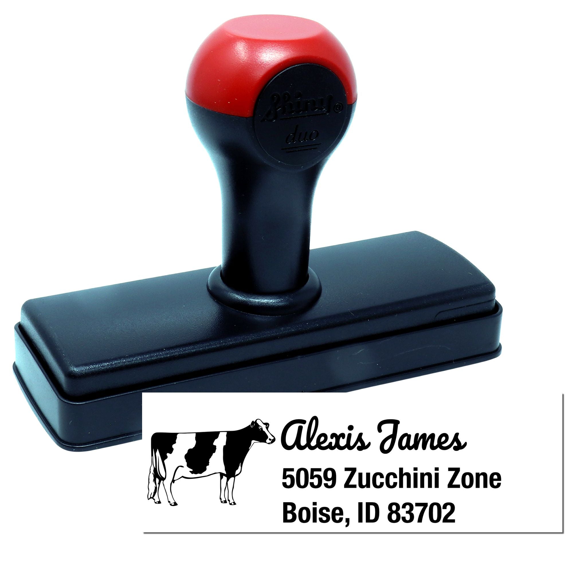 Custom self-inking rubber stamp with cattle ranch logo and return address imprint for business mailing.