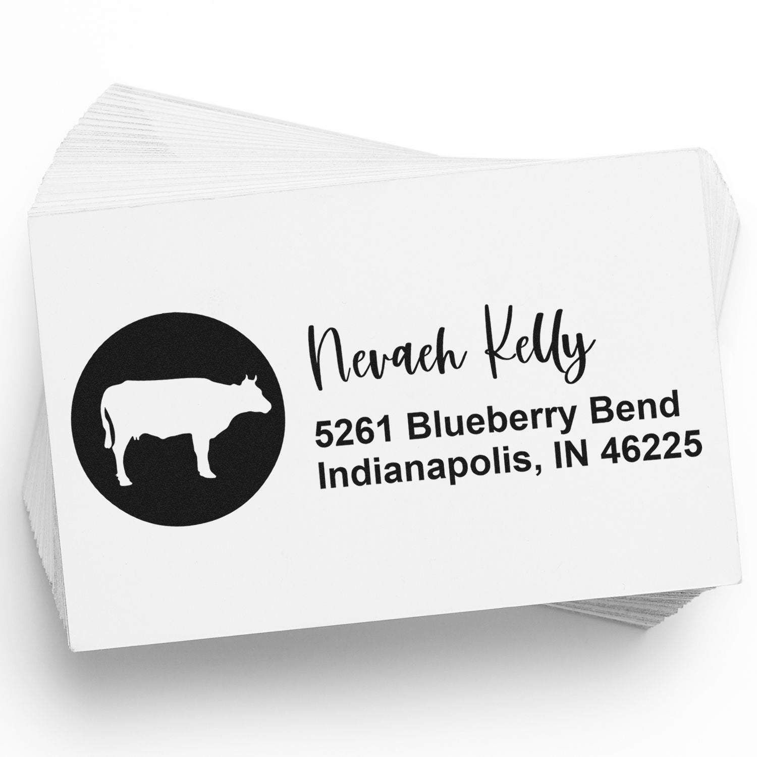 Custom return address rubber stamp with cow logo, name, and Indianapolis, IN mailing address.