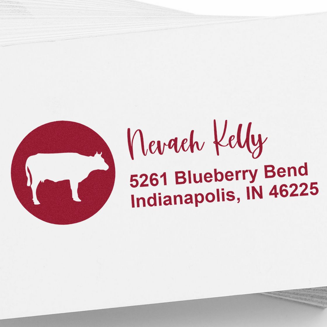 Personalized return address rubber stamp with cow logo for Nevaeh Kelly, Indianapolis, IN 46225.