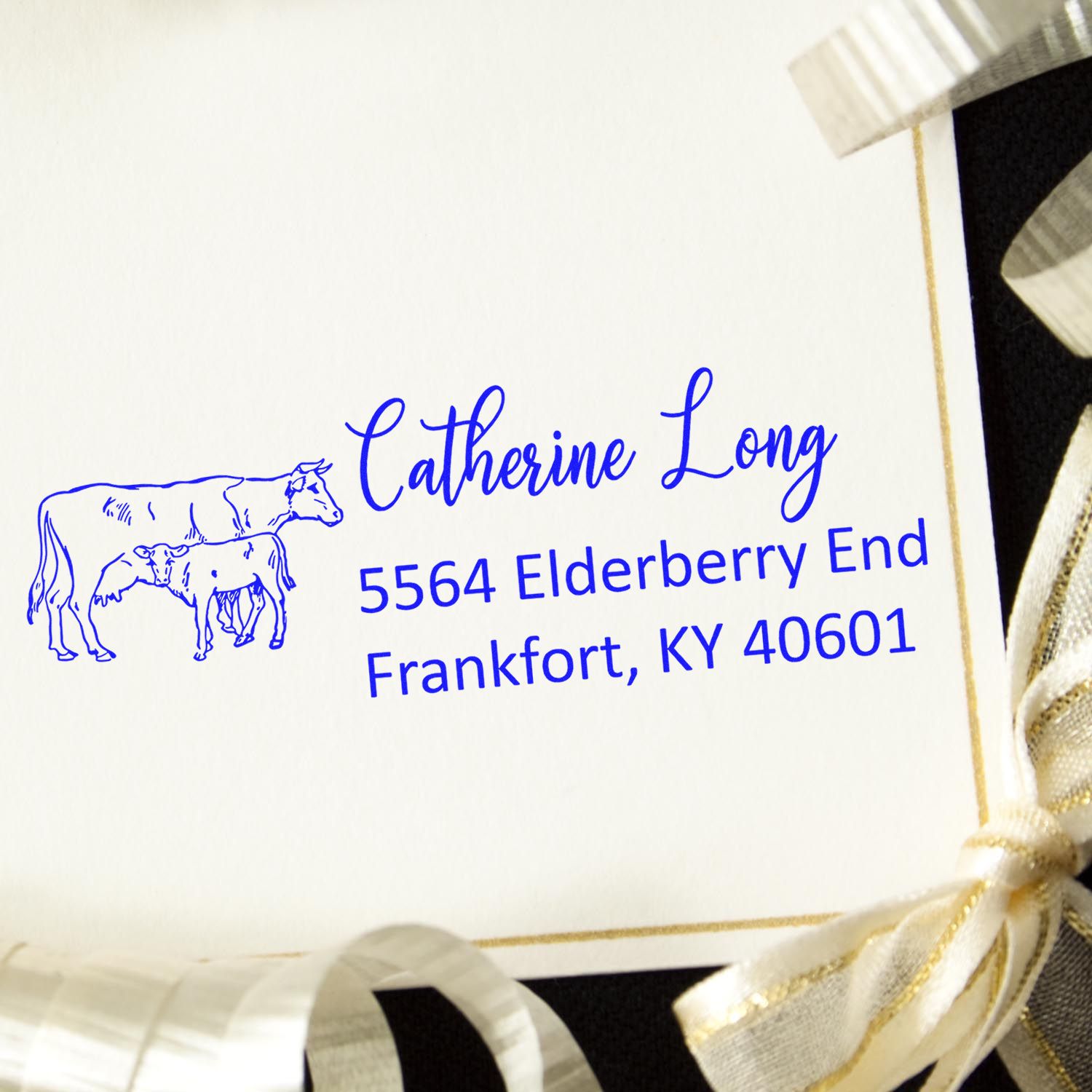 Custom cow return address rubber stamp for Catherine Long, 5564 Elderberry End, Frankfort, KY 40601.