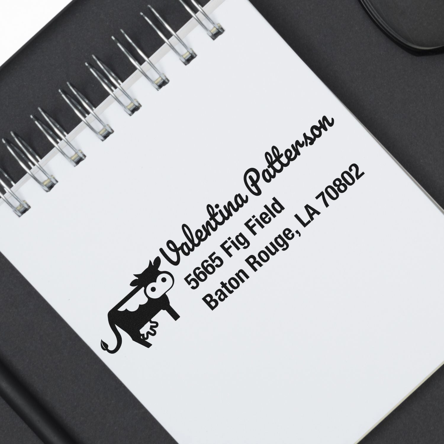 Custom return address rubber stamp for Valentina Patterson, Baton Rouge, LA, with logo for mailing and business branding.