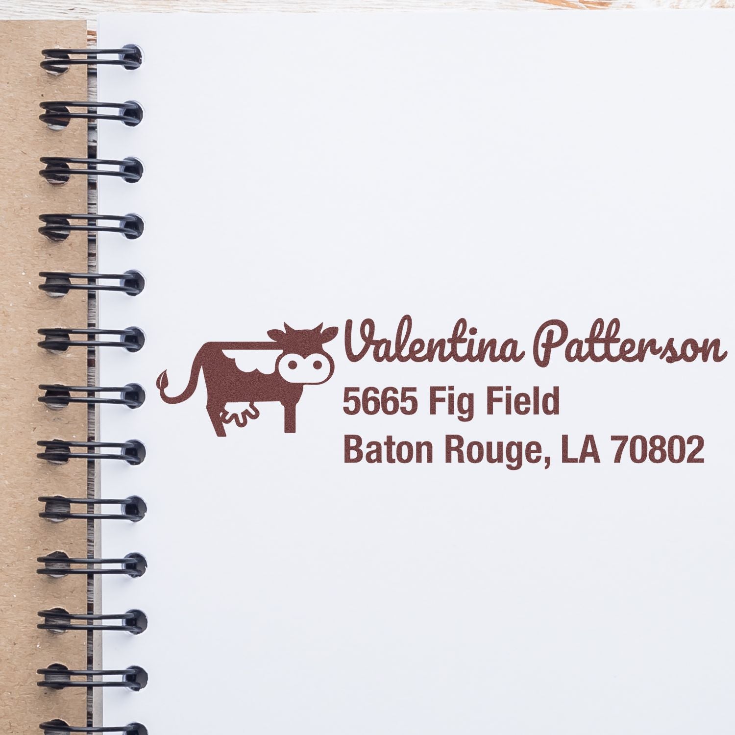 Personalized cow address rubber stamp for Valentina Patterson, Baton Rouge, LA 70802 return mailing label.