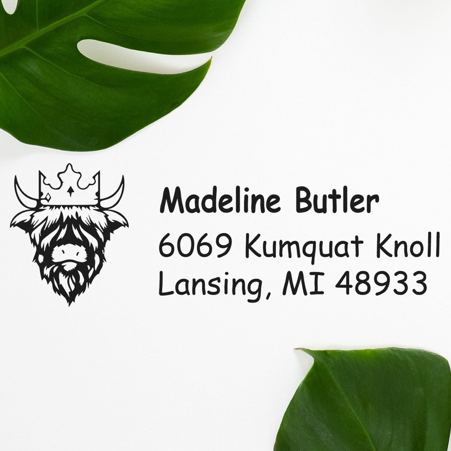 Custom address rubber stamp with cow logo for Madeline Butler, 6069 Kumquat Knoll, Lansing, MI 48933.