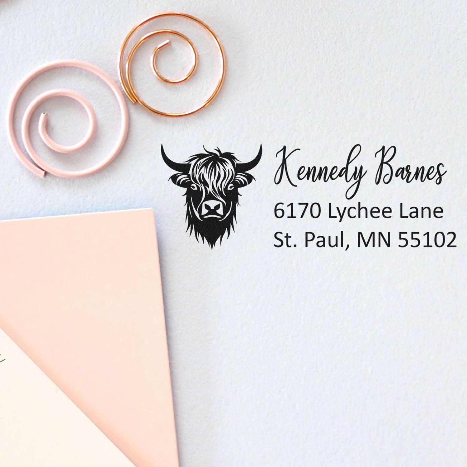 Custom return address rubber stamp with cow logo for Kennedy Barnes, St. Paul, MN 55102.