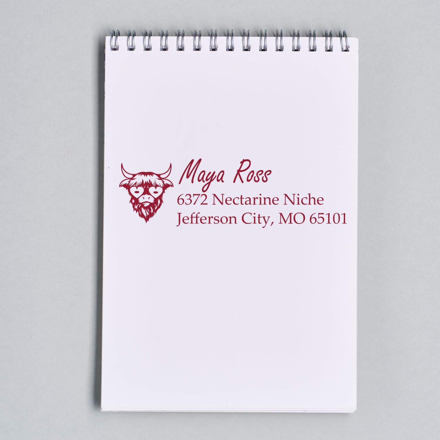 Custom address rubber stamp for Maya Ross with logo and Jefferson City, MO 65101.