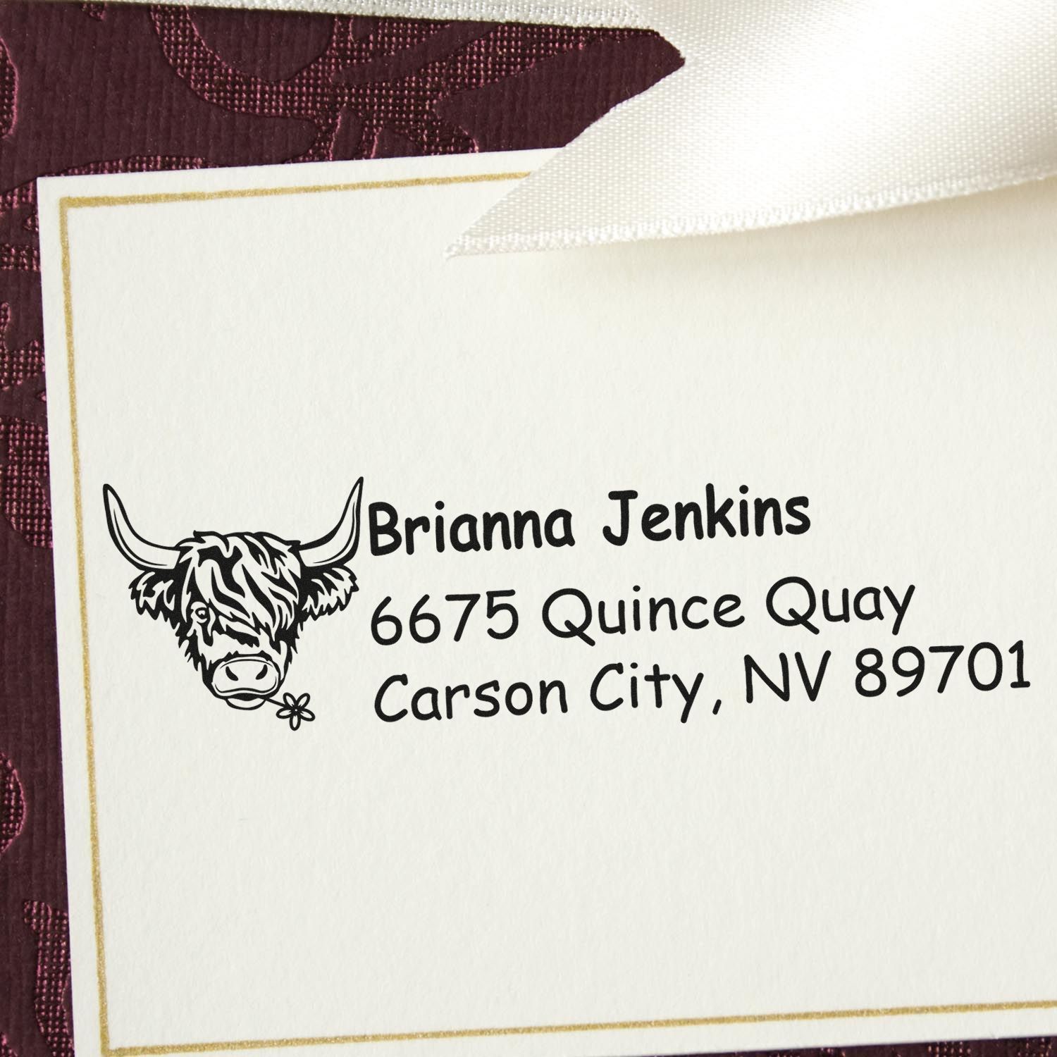 Personalized address rubber stamp with Highland cow design for Brianna Jenkins, Carson City, NV 89701.