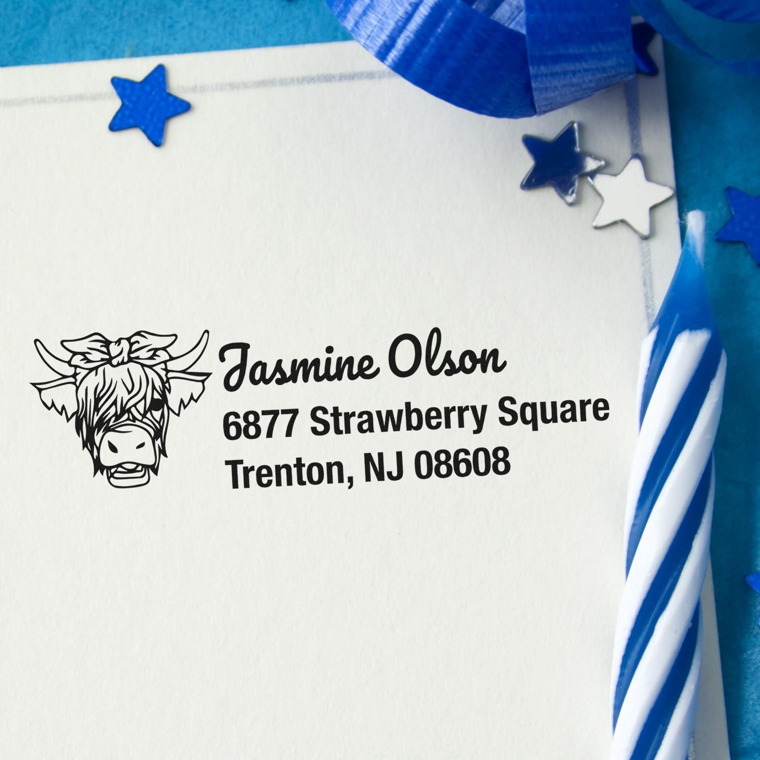 Custom address rubber stamp with cow logo and Trenton, NJ return address on envelope.