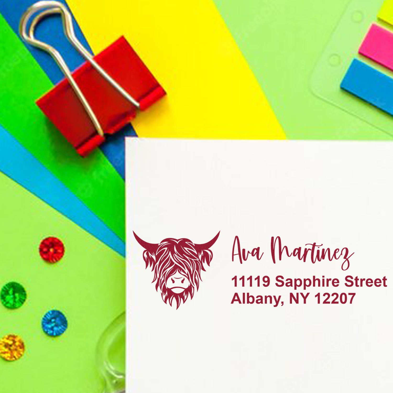 Personalized rubber return address stamp with cow logo for envelopes, showing Ava Martinez name and Albany, NY return address.