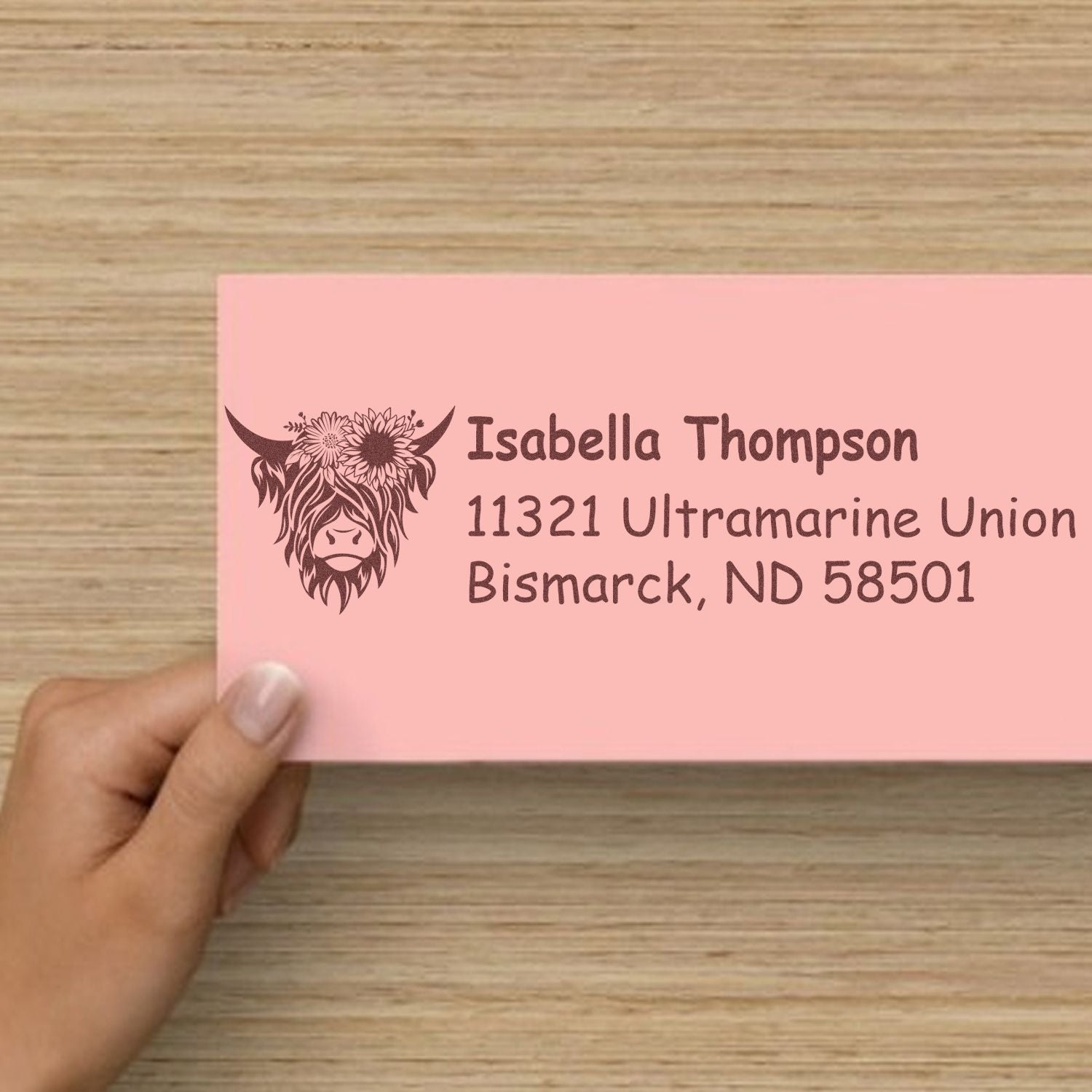 Custom personalized return address rubber stamp with floral highland cow design for Isabella Thompson, Bismarck, ND.