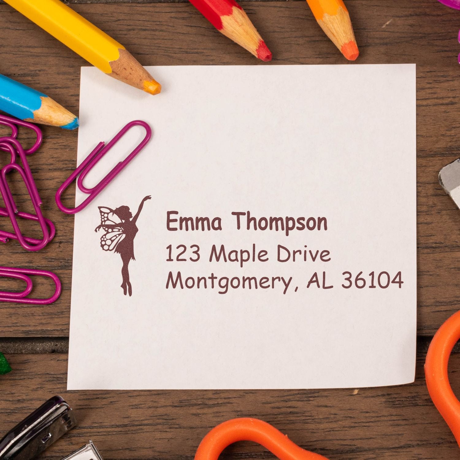 Personalized fairy address rubber stamp on note paper, featuring Emma Thompson and Montgomery, AL return address