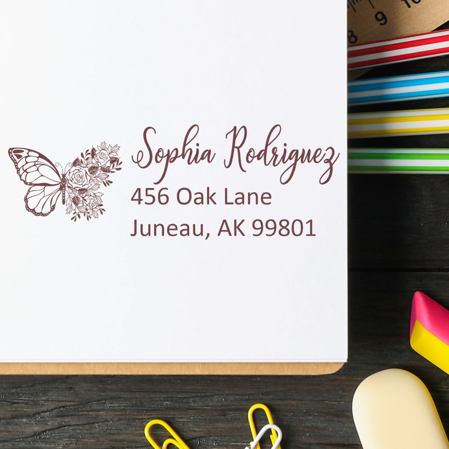Personalized butterfly floral address rubber stamp for Sophia Rodriguezs Juneau, AK return address on envelopes