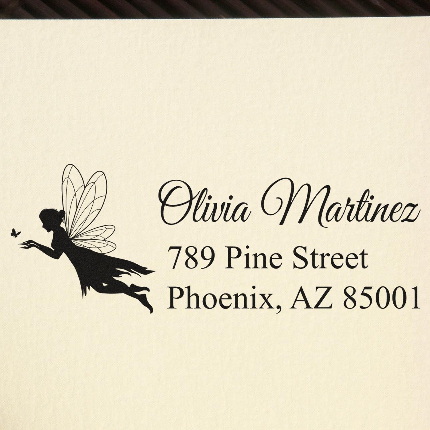 Personalized rubber stamp return address with fairy silhouette for Olivia Martinez, 789 Pine Street, Phoenix, AZ 85001.