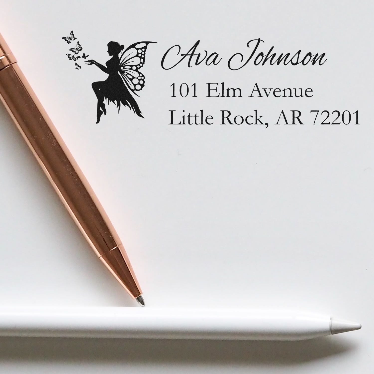 Personalized fairy return address rubber stamp with name, street address, and butterfly motif for envelopes.