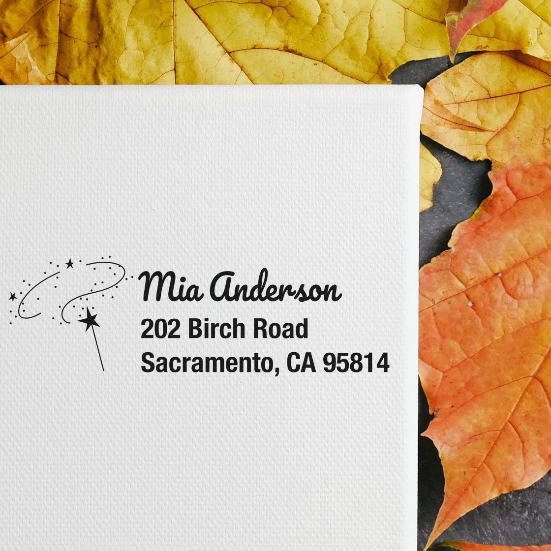 Custom return address rubber stamp sample with star wand design, showing a name and address for personalized mail.