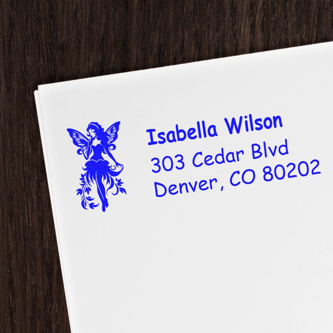 Custom fairy return address rubber stamp for envelopes, featuring Isabella Wilson, 303 Cedar Blvd, Denver, CO 80202.