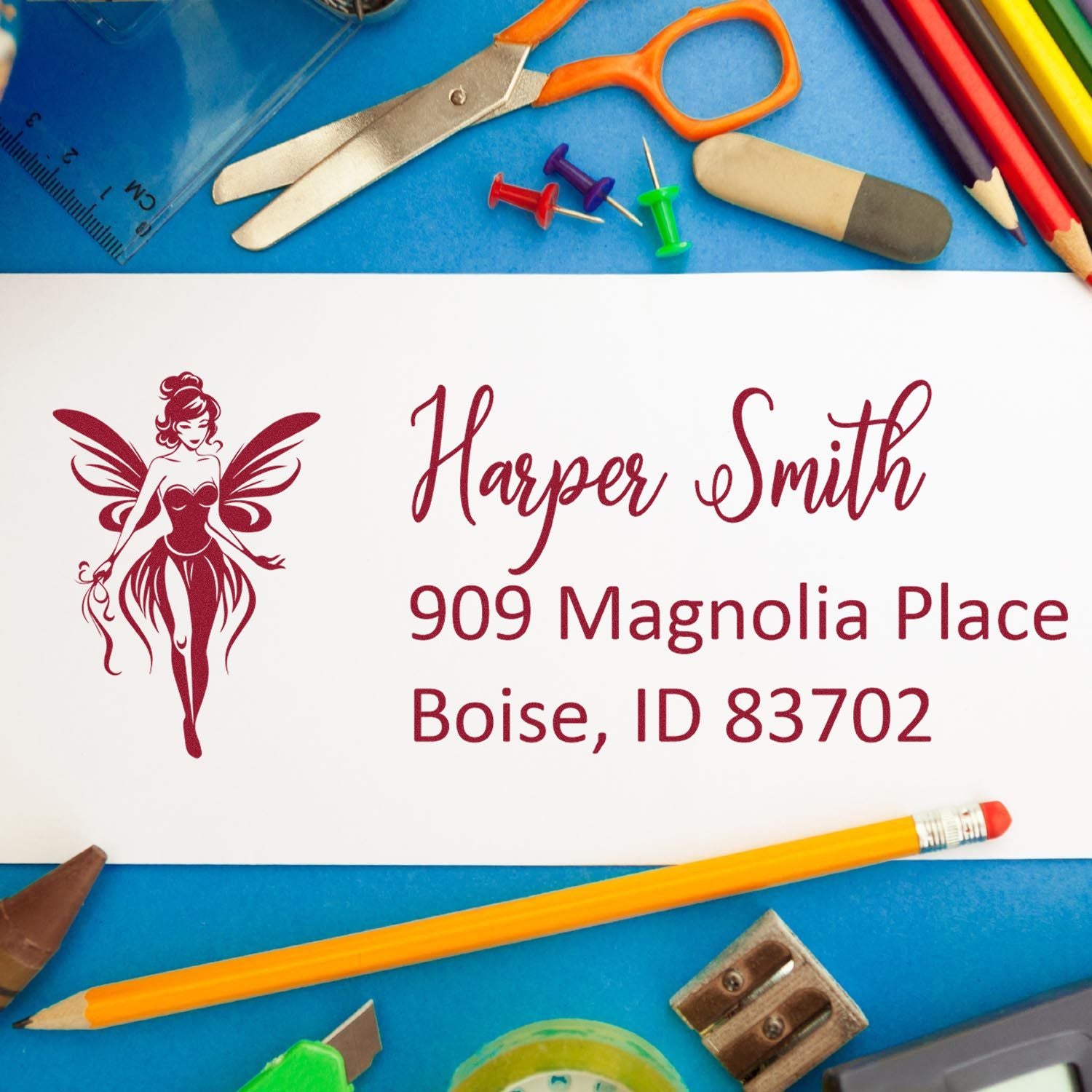 Custom rubber address stamp with fairy logo, Harper Smith name, and Boise, ID address for personalized stationery.