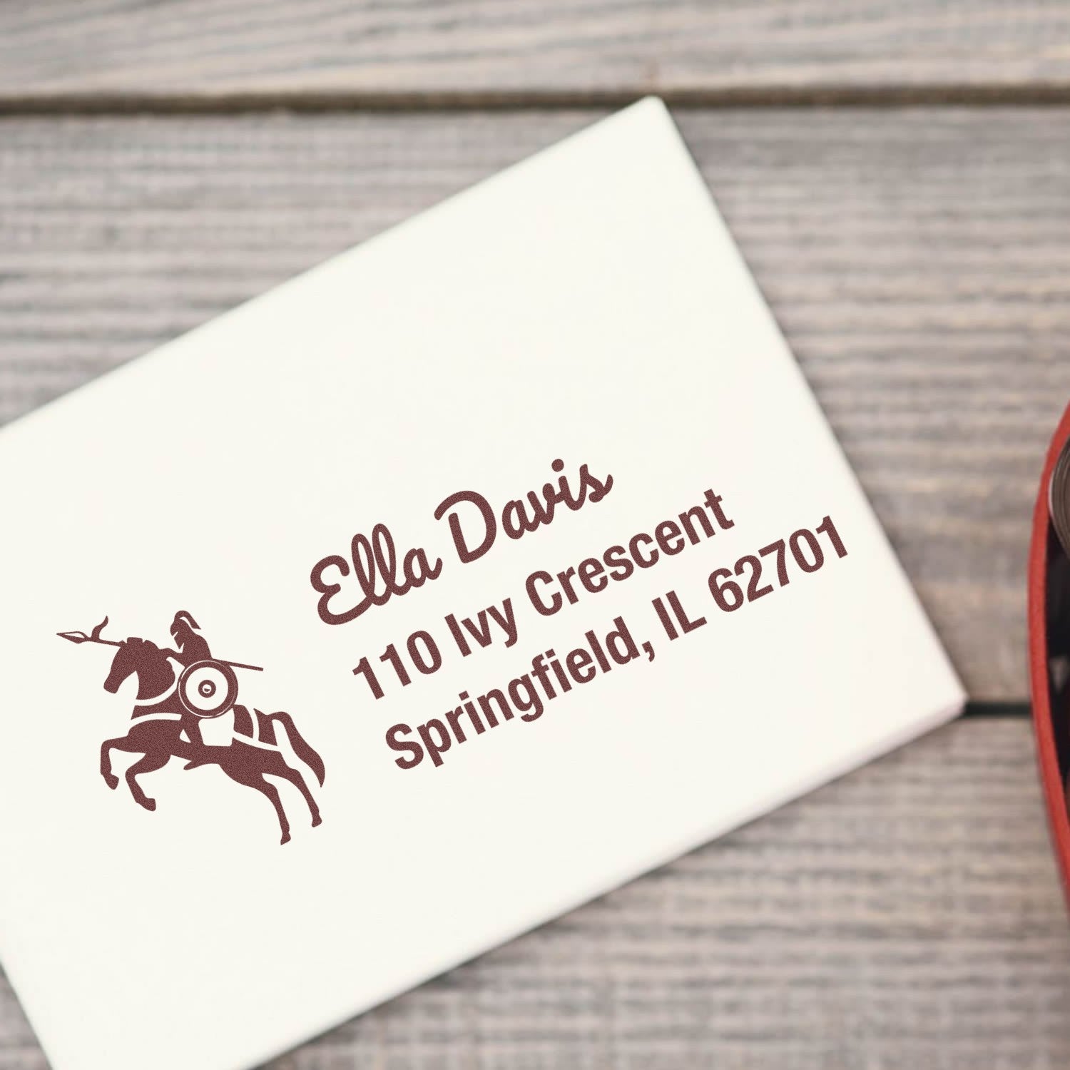Custom horse rider return address rubber stamp on a white envelope, showing a personalized mailing stamp design.