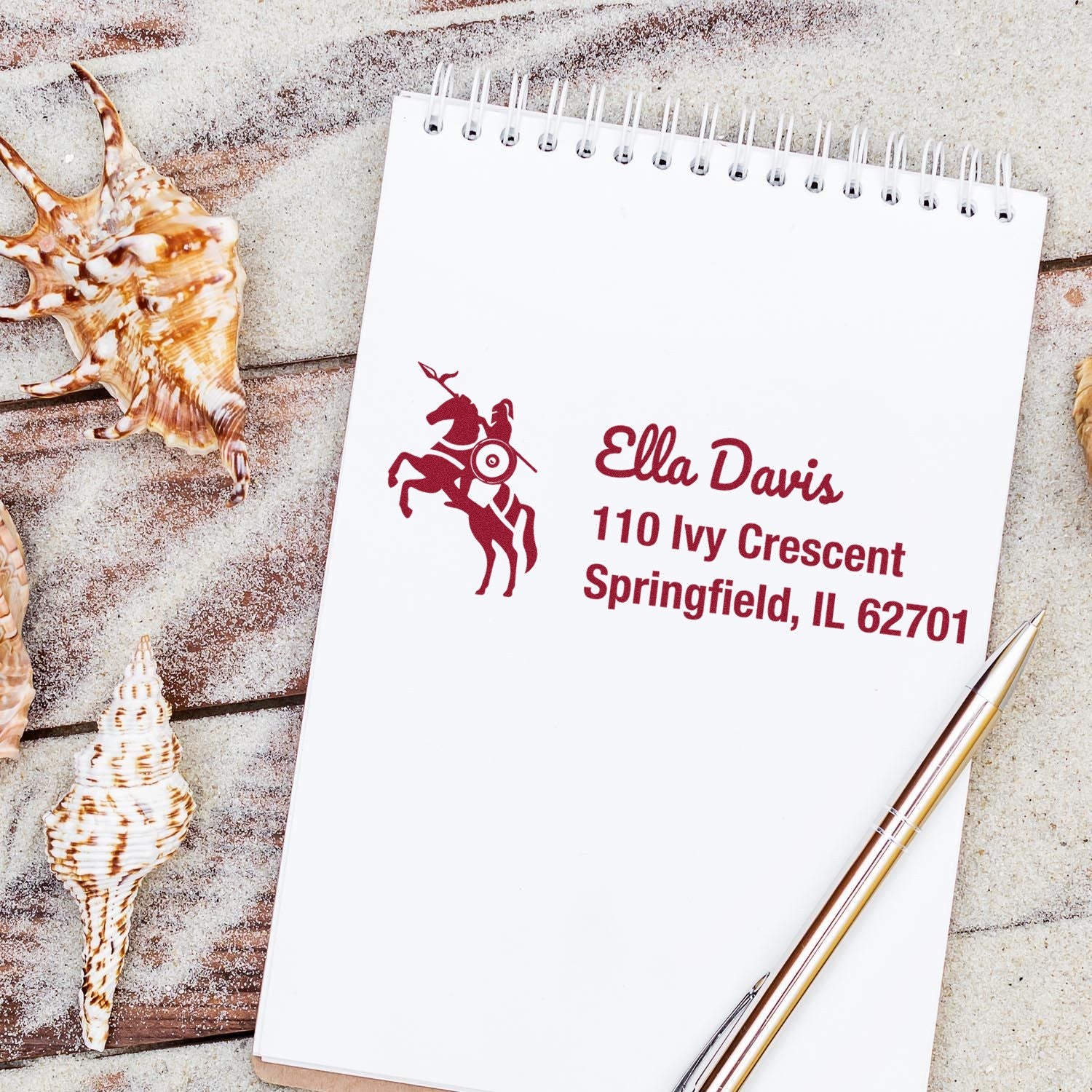 Custom return address rubber stamp with horse rider logo on stationery, ideal for personalized mailing.