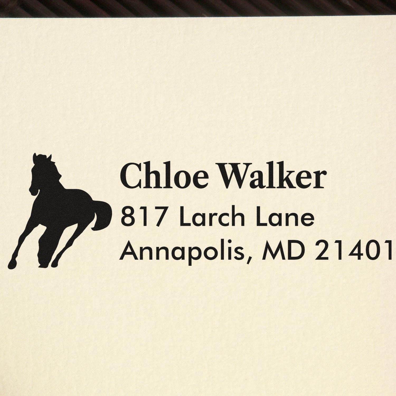 Custom horse silhouette address rubber stamp for Chloe Walker, 817 Larch Lane, Annapolis, MD 21401.