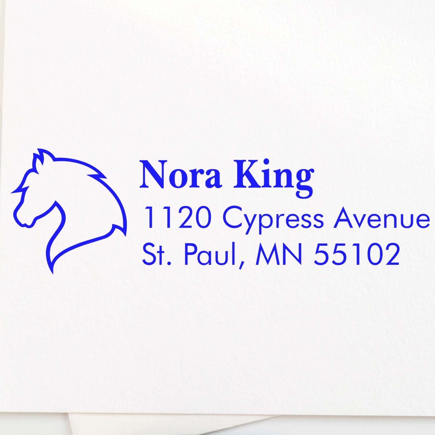 Custom horse logo address rubber stamp for Nora King, 1120 Cypress Avenue, St. Paul, MN 55102.