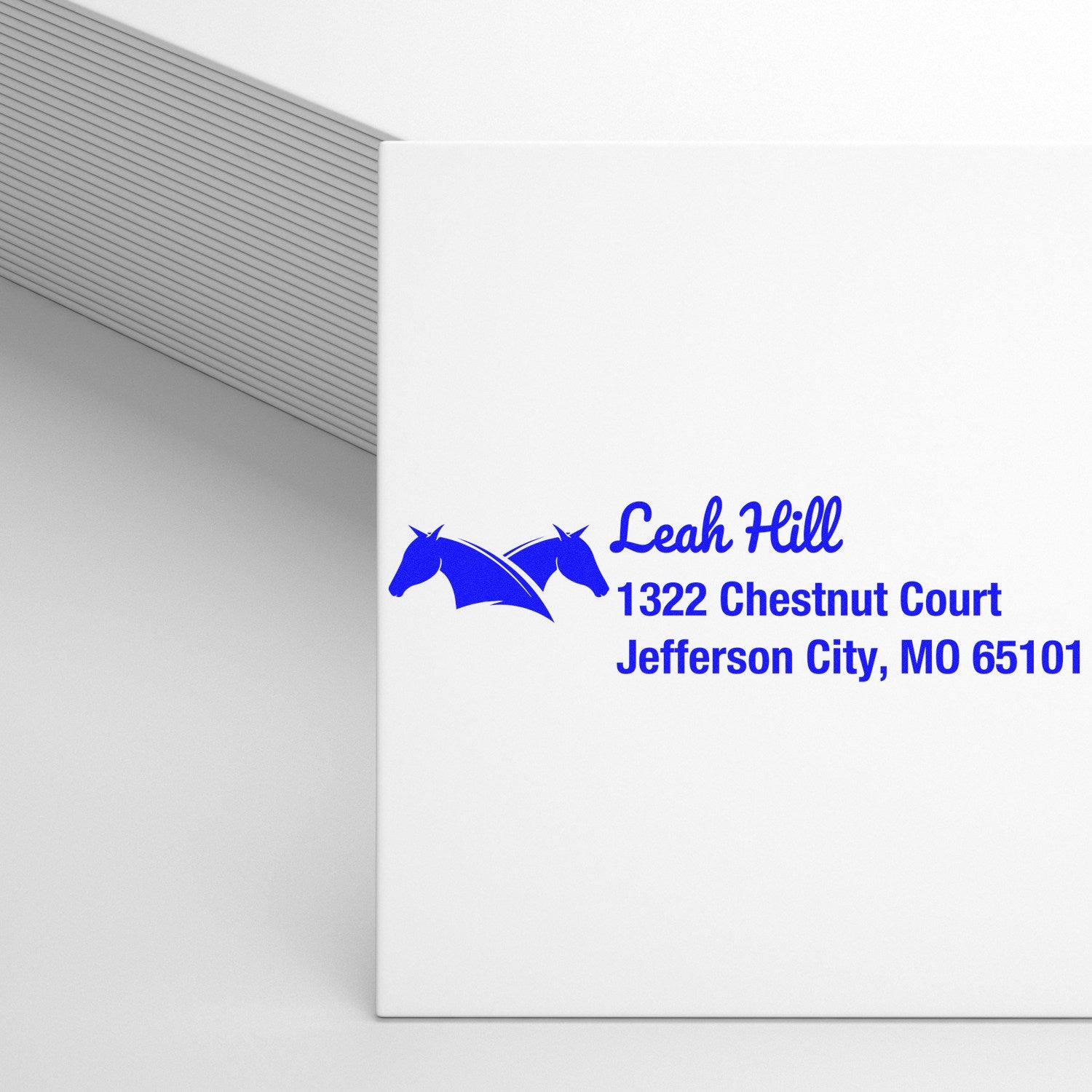 Custom rubber stamp with horse logo and return address for Leah Hill, Jefferson City, MO 65101.